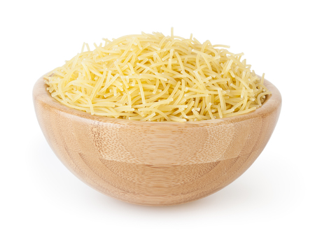 Dried vermicelli pasta in wooden bowl isolated on white backgroundの写真素材