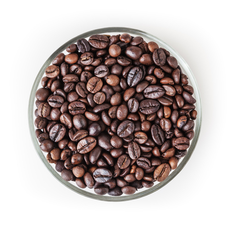 Roasted coffee beans in glass bowl isolated on white background with clipping pathの写真素材