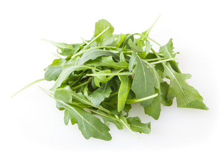 Heap of fresh arugula leaves isolated on white backgroundの写真素材