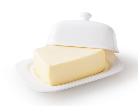 Fresh butter on white butter dish  on white backgroundの写真素材