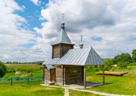 Landscape with the Russian Orthodox Church and cloudy sky. Russian village churchの写真素材