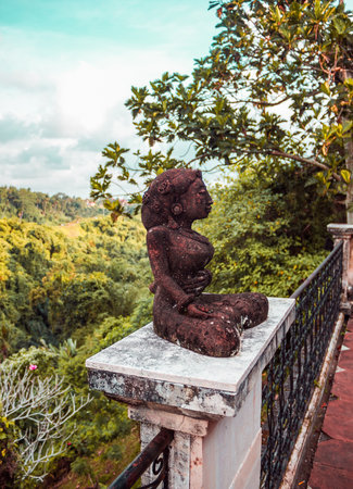 Traditional statue of a woman among the jungles of Ubud in Bali island, Indonesiaの写真素材