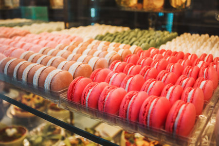 Macaroons cakes in confectionery shop. Colorful Italian sweets. Traditional food for breakfastの写真素材