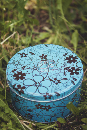 Wedding rings on a blue metal box. Beautiful wedding ringsの写真素材