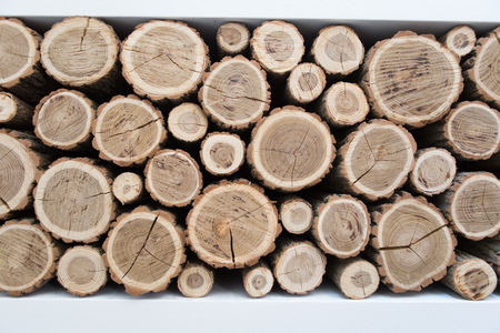 Wall made of stacked wood.