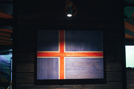 Wooden flag Iceland on a wooden wall. Grunge National flag Iceland. Wooden flag Scandinavia.の写真素材