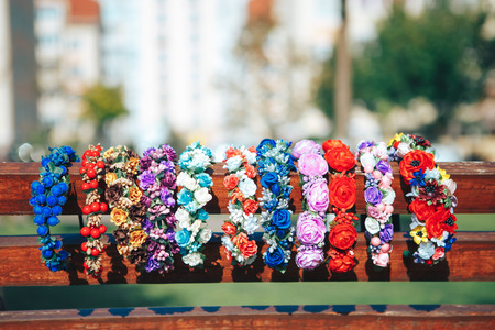 Multicolored hair ornament handmade. Different hair hoops with artificial flowers.の写真素材