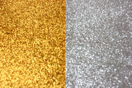 Abstract background half gold and half silver with bokeh and glitter effect with copy space.の写真素材