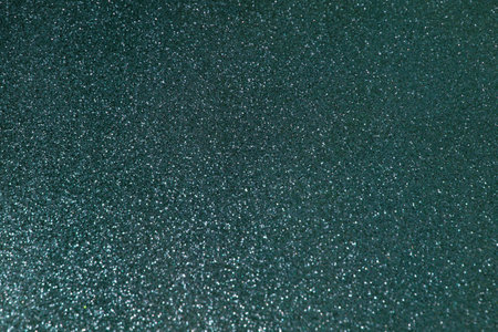 Abstract dark green background glitter effect and gradient for festive design.の写真素材