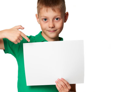 Young smart school boy examines bacteria under a microscope in science class studying biology