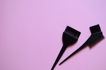 hairdressing brushes on pink background, hair coloring brushes, beauty salon banner, pink background, templateの写真素材