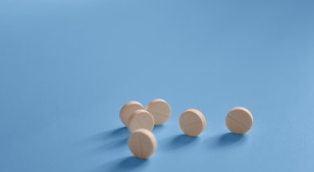 banner, background for a medical website or article, pills rolling on a blue background, medicines, medical careの写真素材