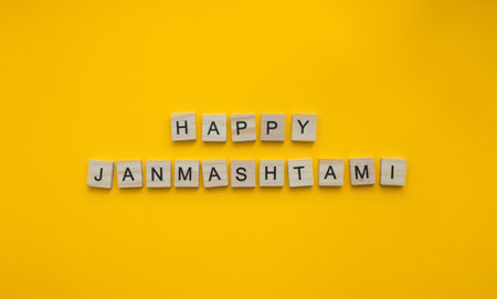 On September 6, happy Krishna Janmashtami, a minimalistic banner with an inscription in wooden lettersの写真素材