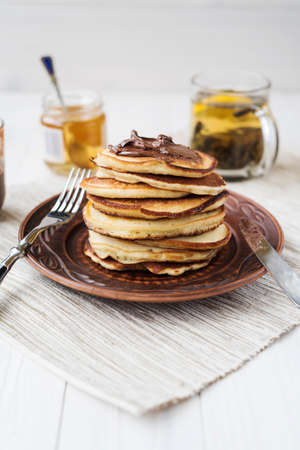 Pancakes with chocolate and honeyの写真素材