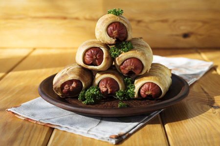 Sausage dough on a wood backgroundの写真素材
