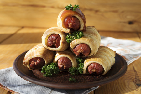 Sausage dough on a wood backgroundの写真素材