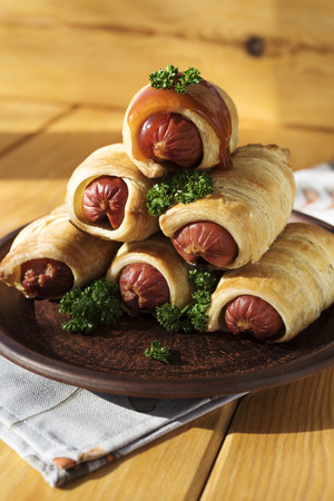 Sausage dough on a wood backgroundの写真素材