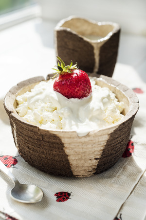 Cottage cheese with sour cream and strawberryの写真素材