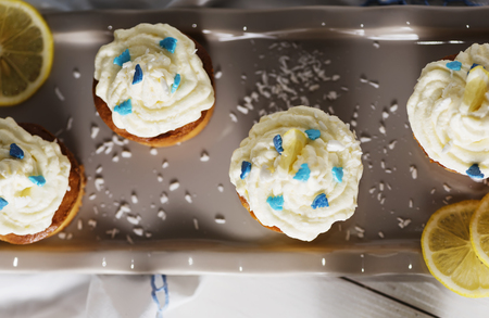 Lemon ricotta cupcakes with coconut creamの写真素材