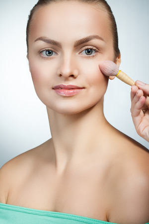 portrait of a beautiful woman caring for her appearanceの写真素材