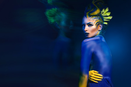 woman in sea mythical image with art visage visageの写真素材