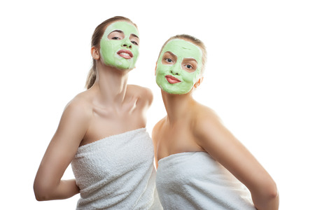 Two girlfriends with medical mask on her faceの写真素材