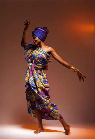 Dance hot African night, a beautiful woman in a bright dressの写真素材
