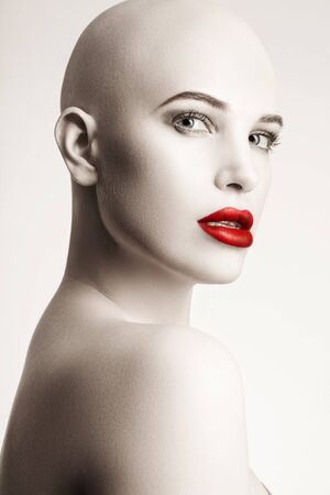 beautiful and young, bald woman struggling with cancer, strong and self-confidentの写真素材