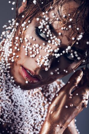 close shot of a female face covered with ballsの写真素材