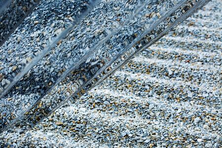 photo with metal constructions and stone, cold abstraction