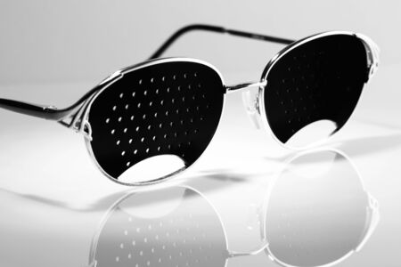 corrective glasses for people with astigmatism, glasses on a white backgroundの写真素材