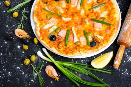 seafood pizza, pizza ingredients, tasty and hearty foodの写真素材