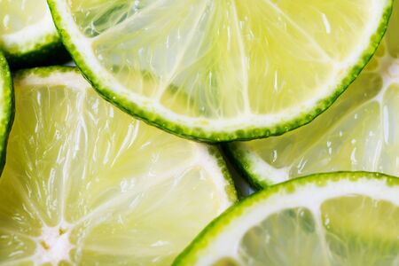sliced lime, sour citrus for drinksの写真素材