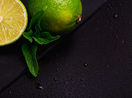 green fresh line with mint leaves on dark backgroundの写真素材