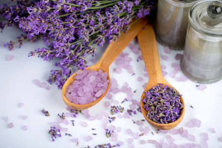 two wooden spoons with lavender flowers and aromatic lavender saltの写真素材