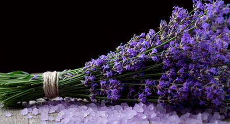 bouquet of fragrant lavender with lavender salt on a dark backgroundの写真素材