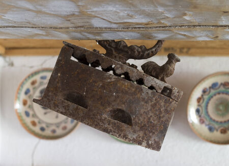 Vintage interier with old rusty iron and platesの写真素材