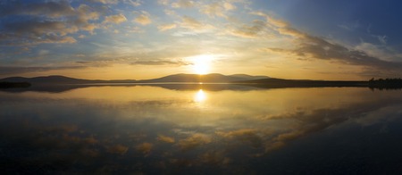 Beautiful sunset on a lake, Lapland, Finlandの写真素材