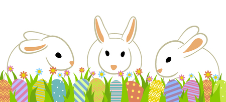 Easter eggs and three rabbits in grass isolated on white.のイラスト素材