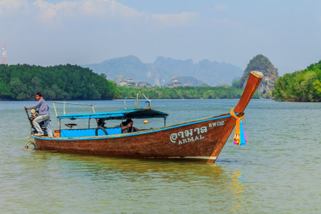 Longtail boat in Krabi Thailand, with Kanab Nam Mountains in the backgroundのeditorial素材