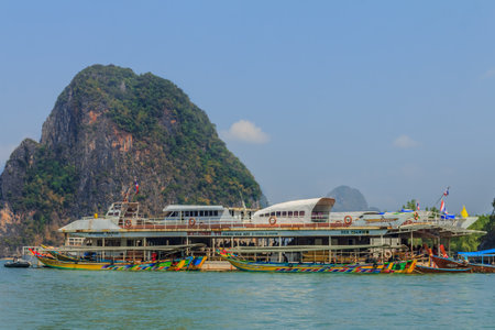 Longtail boat in Krabi Thailand, with limestone islands in the backgroundのeditorial素材