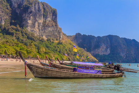 Ao Nang Beach, Krabi, Thailand - January 26, 2014: Longtail boats docked at the beautiful Ao Nang beach in Krabi Thailandのeditorial素材