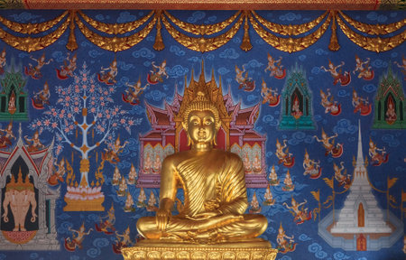 Statue of buddha and religious wall paintings in Wat Kaew Korawaram Temple in Krabi, Thailandのeditorial素材
