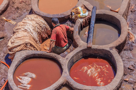 Fes, Morocco - May 11, 2013: Workers handling hides at a tannery in Fes, Moroccoのeditorial素材