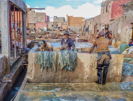 Marrakech, Morocco - December, 08, 2012: Workers handling hides at a tannery in Marrakech, Morocco handling hides at a tannery in Marrakech, Moroccoのeditorial素材