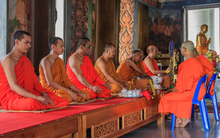 Krabi, Thailand - January 24th, 2014: Buddist monks praying in the Wat Kaew Korawaram Templeのeditorial素材