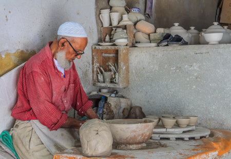 Fes, Morocco - May 11, 2013: Moroccan potter at work in a pottery shopのeditorial素材