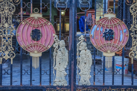 Georgetown Penang Malaysia  August 21 2013: Old Chinese style metal gate knockers with lion heads in George Town Penang Malaysia the UNESCO world heritage siteのeditorial素材