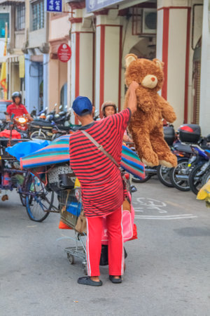 Georgetown Penang Malaysia  August 17 2013: Street vendor cart at a flea market on a street in Georgetown Malaysiaのeditorial素材