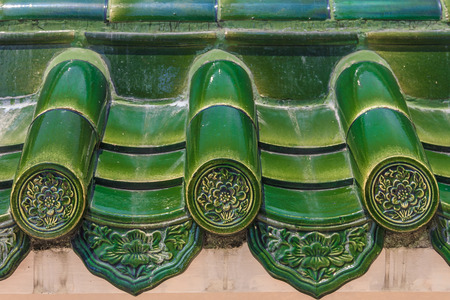 Old roof of Chinese temple with beautiful green glazed tile pattern at the Seh Tek Tong Cheah Kongsi temple in Georgetown Penang Malaysiaの写真素材